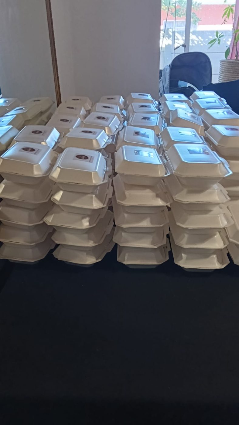 Stacks of meal containers on a table