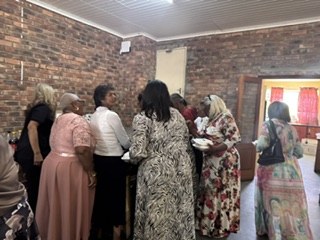 Guests queuing in the brick hall